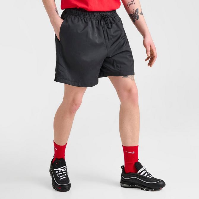 [angle] view of Men's Nike Club Woven 6" Flow Shorts in Black/White Click to zoom