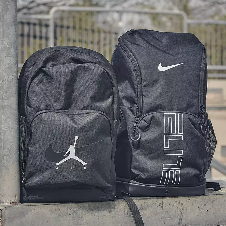 A black Nike ZoomX running shoe and a cream and light blue Air Jordan 1 High sneaker sit above text reading Featured Deal Nike & Jordan Up to 50% Off.