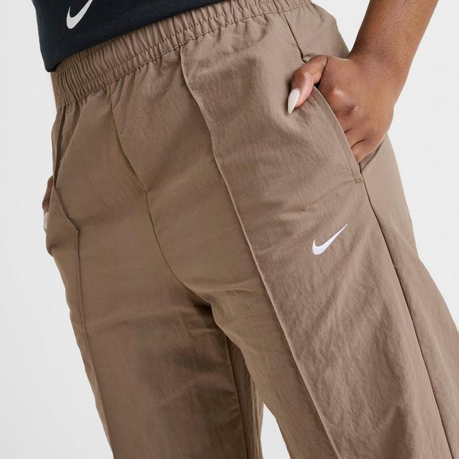 [angle] view of Women's Nike Sportswear Everything Wovens Mid-Rise Open-Hem Pants in Mink Brown/White Click to zoom