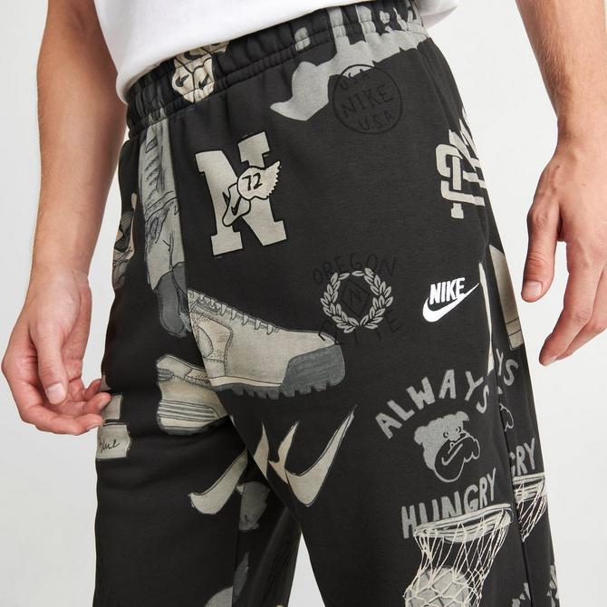 Nike Monogram All Over Logo Print Fleece Cuffed Sweatpants in Pink