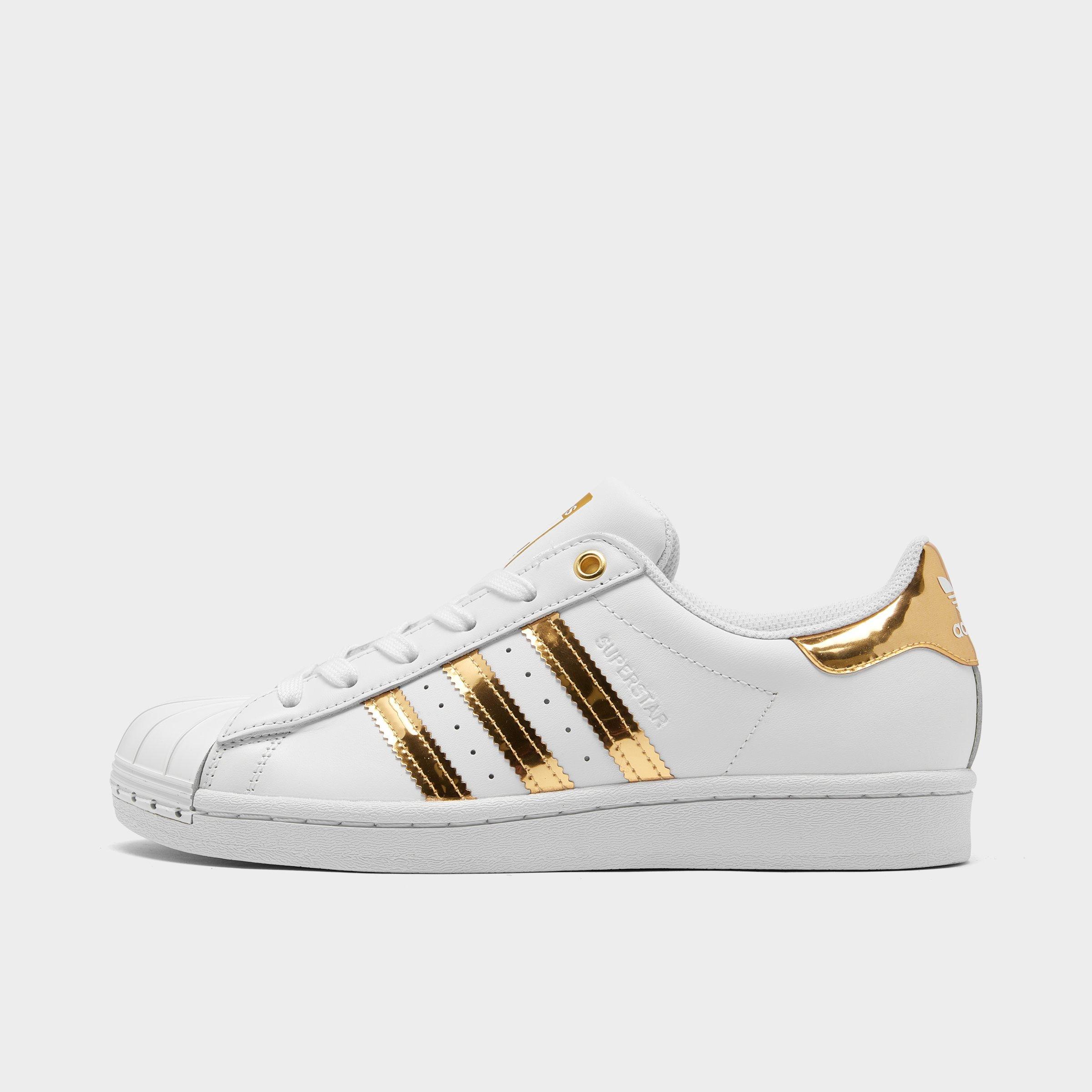 white and gold superstars