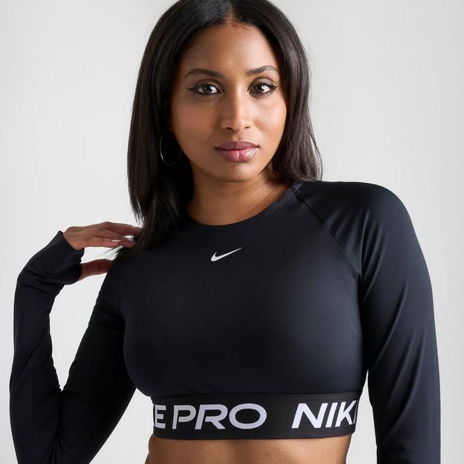 Nike Repeat Tape detail long sleeve crop top in black