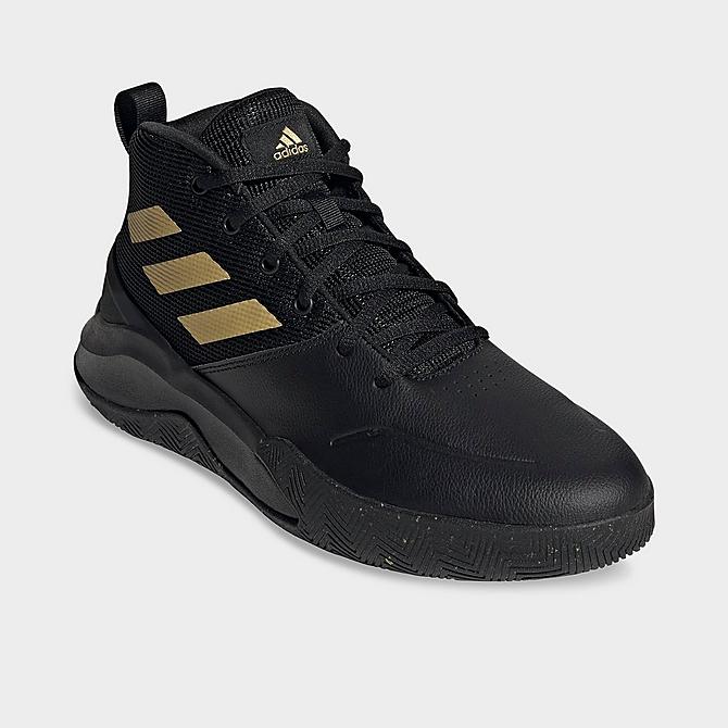 Three Quarter view of adidas OwnTheGame Basketball Shoes in Core Black/Matte Gold/Core Black Click to zoom