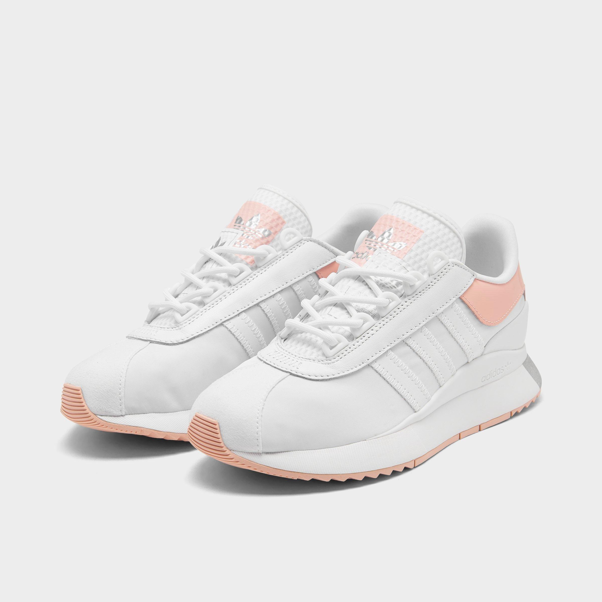 pink and white adidas sneakers 