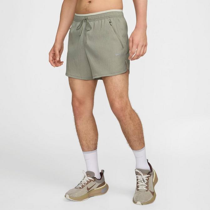 [angle] view of Men's Nike Stride Running Division Dri-FIT Seersucker 5" Brief-Lined Shorts in Dark Stucco/Light Bone Click to zoom