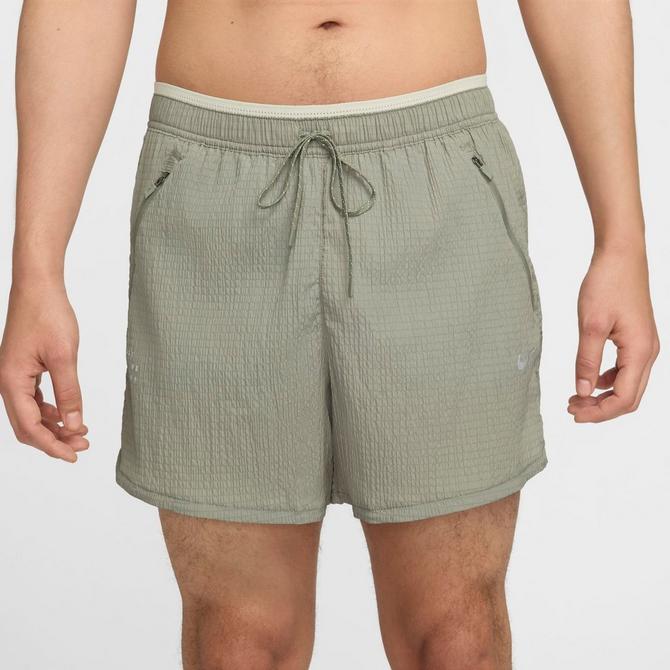 [angle] view of Men's Nike Stride Running Division Dri-FIT Seersucker 5" Brief-Lined Shorts in Dark Stucco/Light Bone Click to zoom