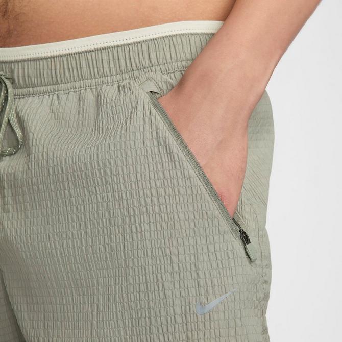 [angle] view of Men's Nike Stride Running Division Dri-FIT Seersucker 5" Brief-Lined Shorts in Dark Stucco/Light Bone Click to zoom