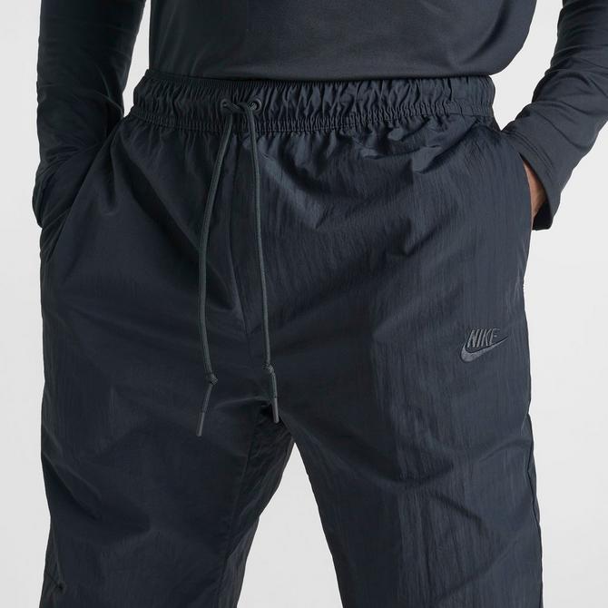 [angle] view of Men's Nike Tech Woven Straight Leg Pants in Black/Black Click to zoom