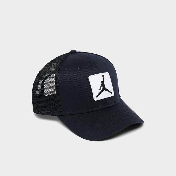 Left view of Jordan Rise Trucker Hat in Black/White Click to zoom