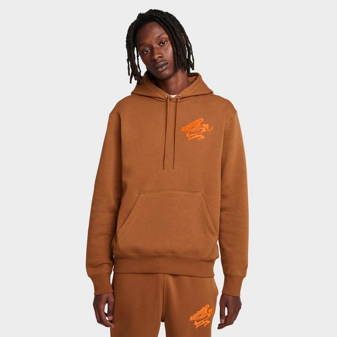 [angle] view of Men's Nike Sportswear Club Victory Graphic Hoodie in Light British Tan/Light British Tan/Safety Orange Click to zoom
