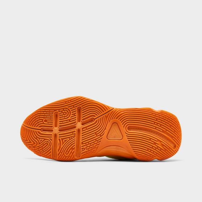 Bottom view of Big Kids’ Nike Giannis Immortality 4 Basketball Shoes in Cyber/Bright Mandarin/Sundial/Lightning Click to zoom