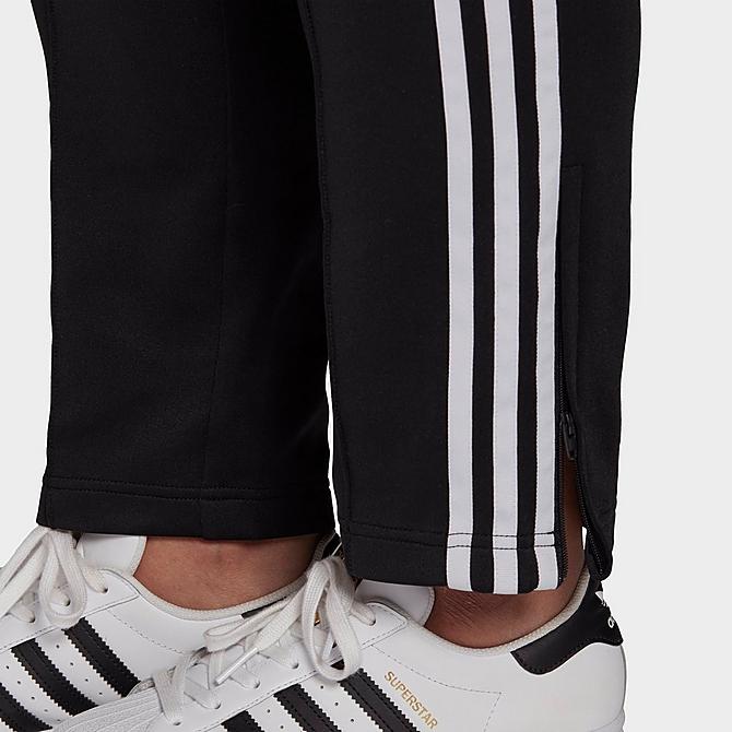 On Model 6 view of Women's adidas Originals Primeblue SST Track Pants (Plus Size) in Black Click to zoom