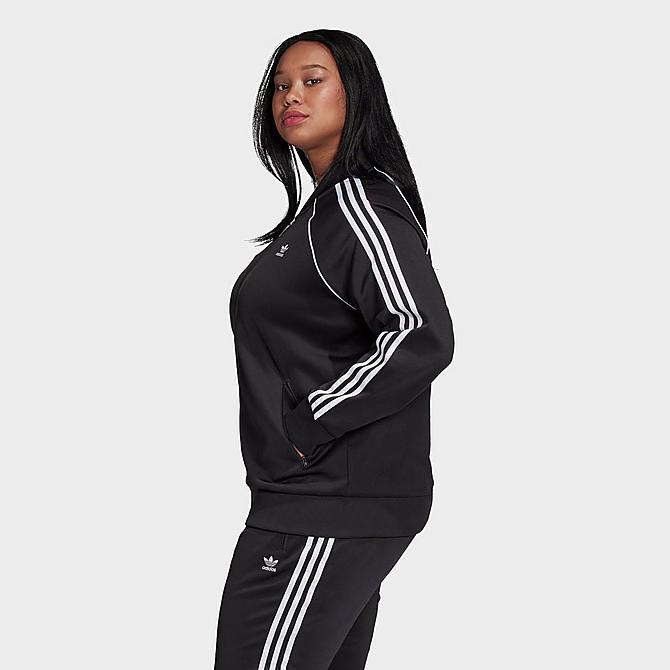 Front Three Quarter view of Women's adidas Originals Primeblue SST Track Jacket (Plus Size) in Black/White Click to zoom