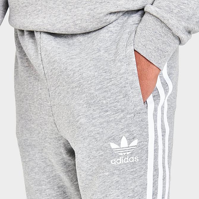 On Model 5 view of Kids' adidas Originals 3-Stripes Jogger Pants in Medium Grey Heather/White Click to zoom