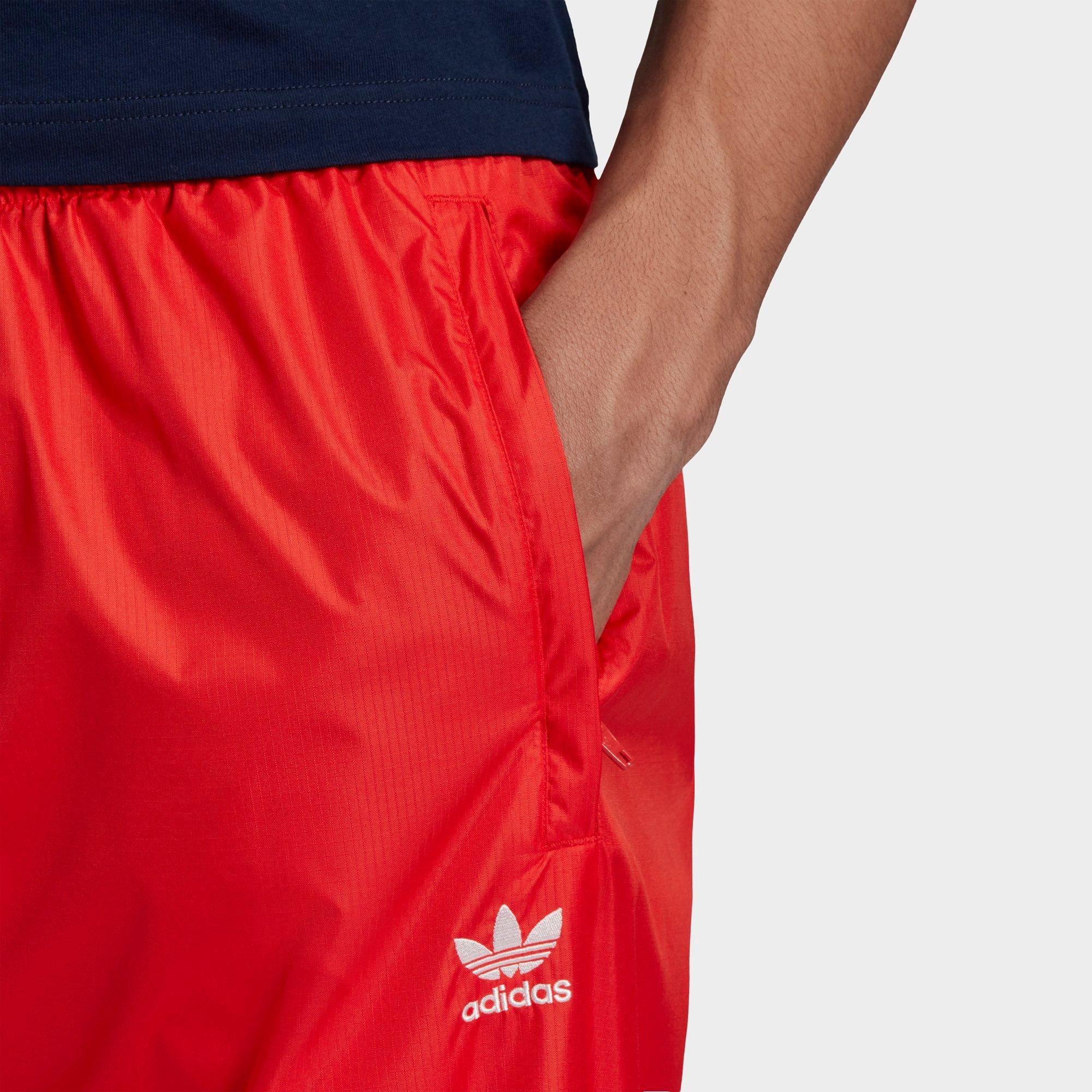 adidas originals adicolor three stripe track pants in red