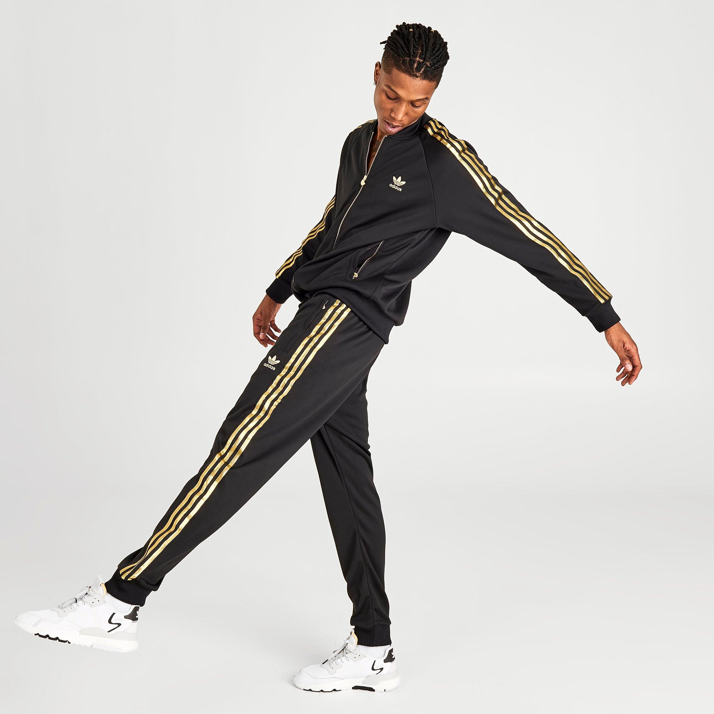 black and gold adidas track pants