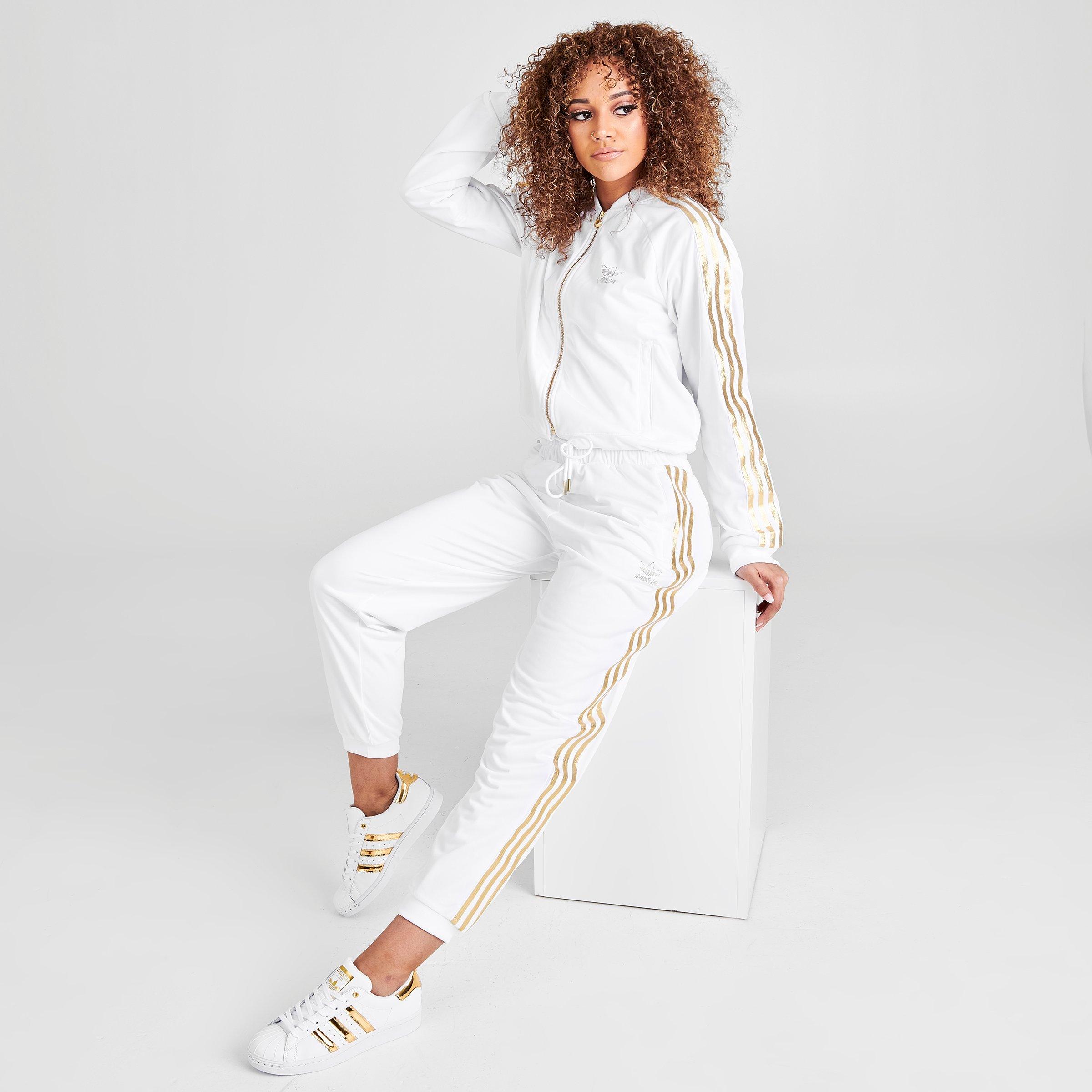 white and gold adidas track pants