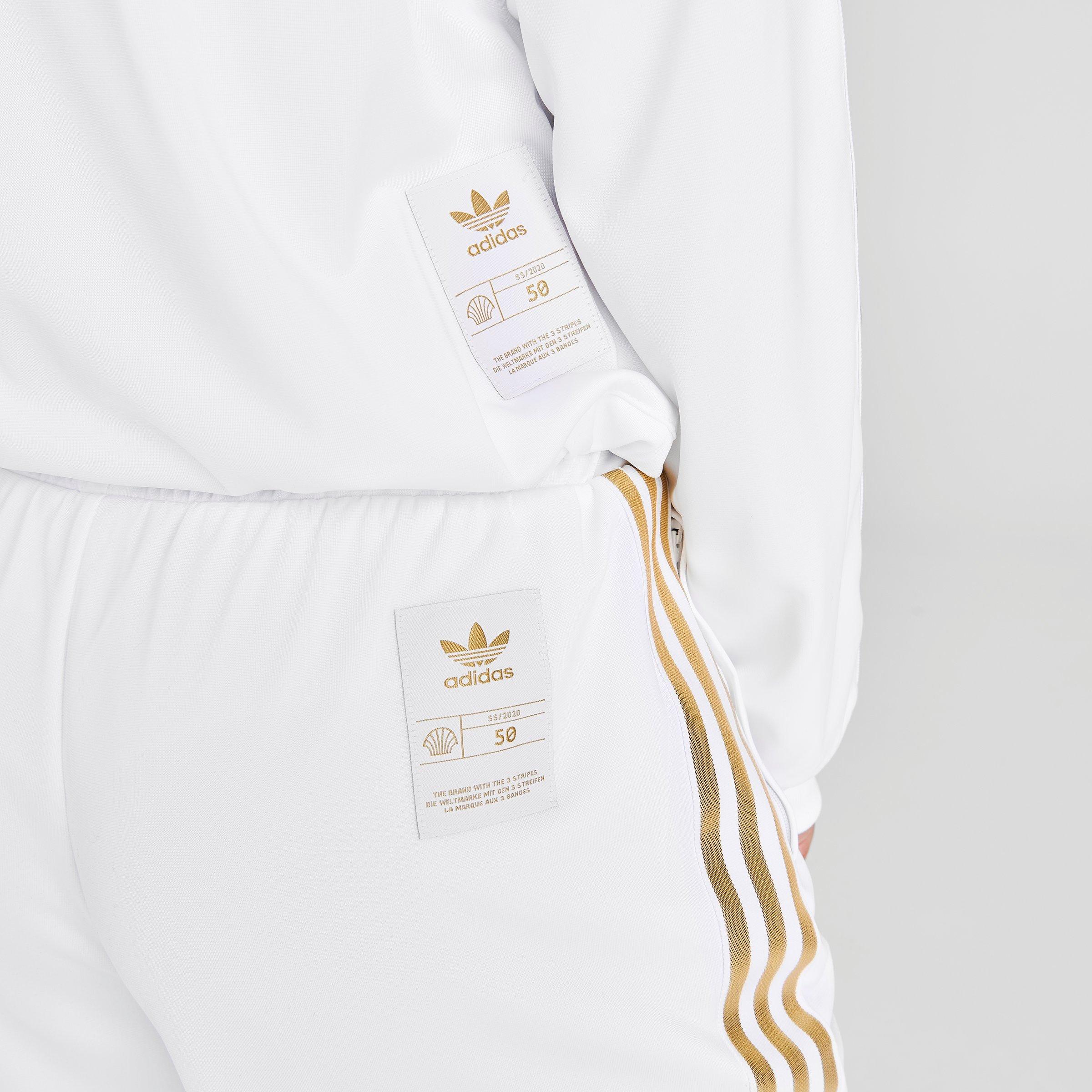 white and gold adidas track pants