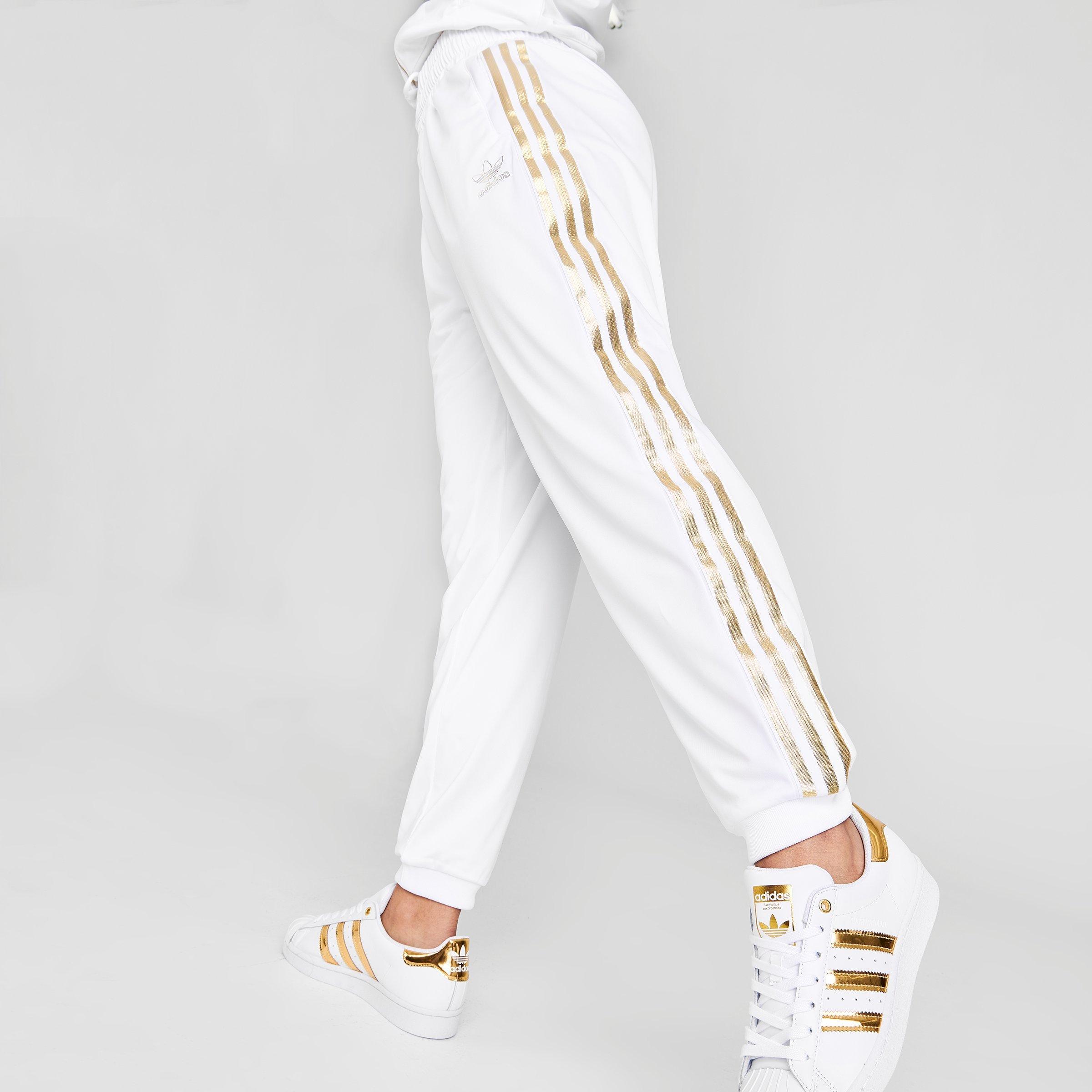 white and gold adidas track pants