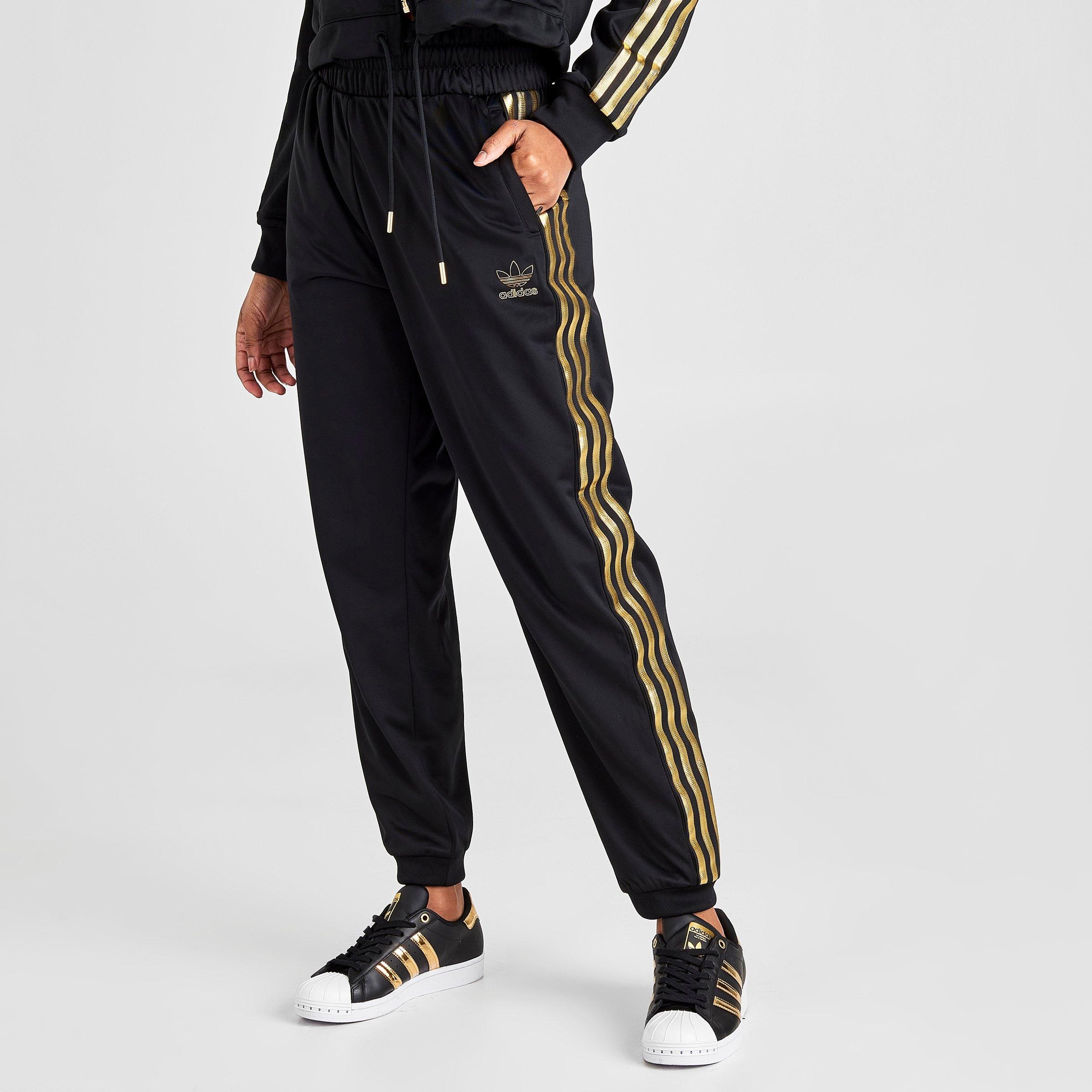 adidas pants with gold stripes