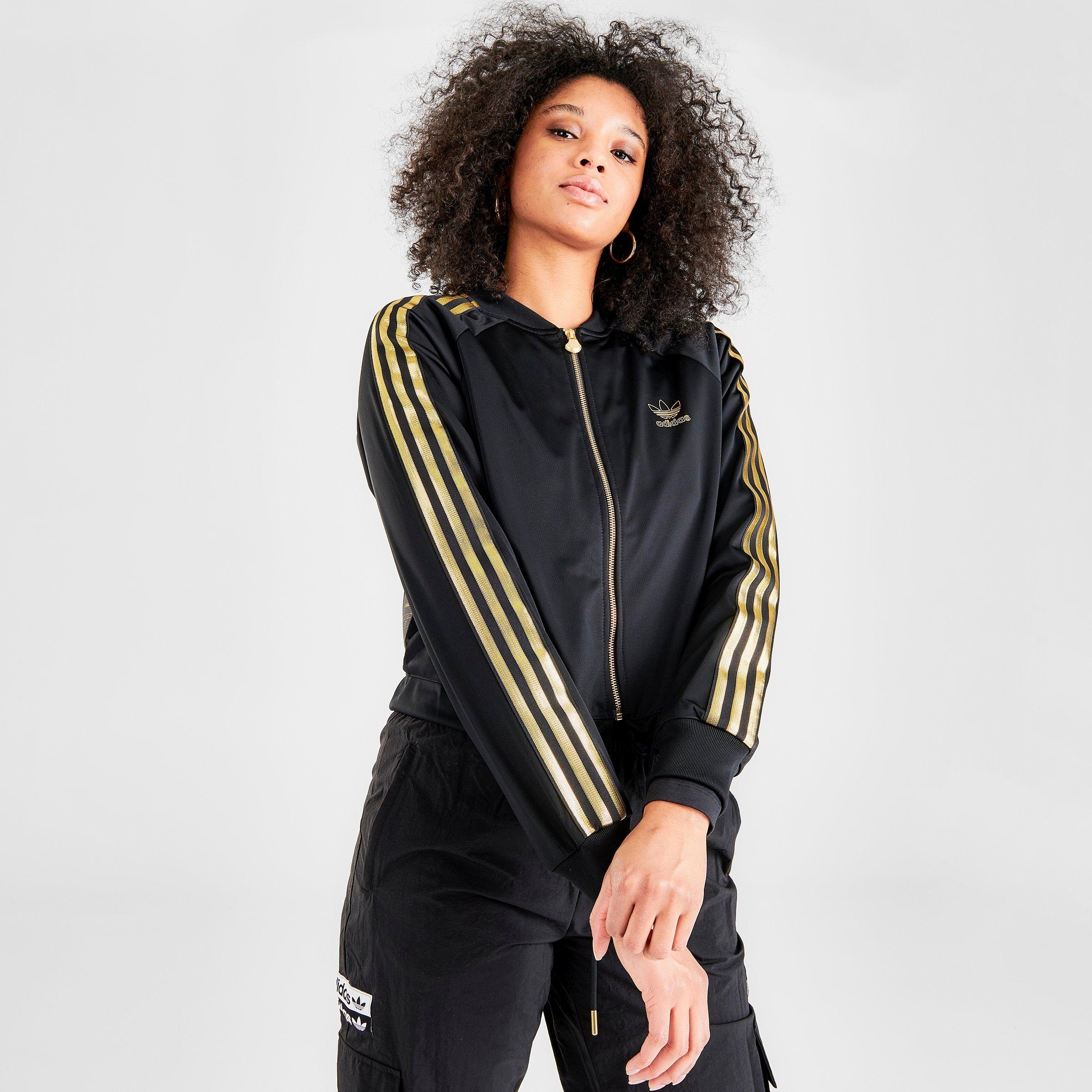 black adidas jacket with gold stripes