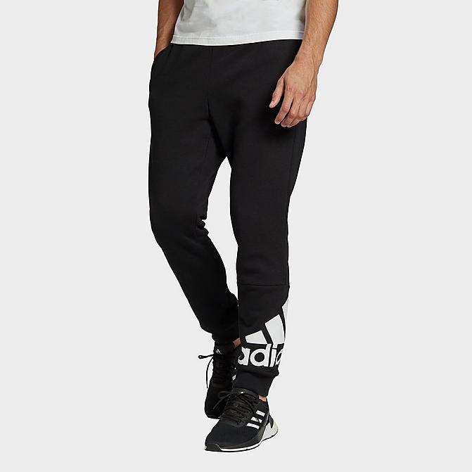 Front view of Men's adidas Essentials Tapered Cuff Logo Fleece Pants in Black/White Click to zoom