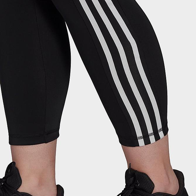 On Model 5 view of Women's adidas Designed To Move High-Rise 3-Stripes Cropped Training Tights (Plus Size) in Black/White Click to zoom