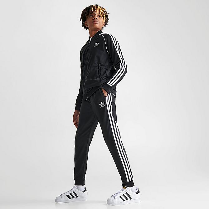 Front Three Quarter view of Kids' adidas Originals Adicolor SST Jogger Track Pants in Black/White Click to zoom