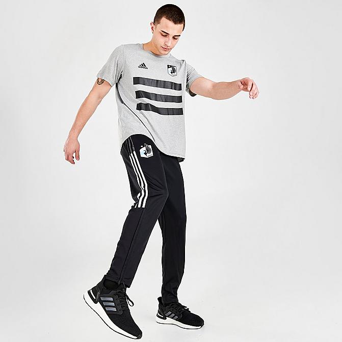 [angle] view of Men's adidas Minnesota United FC Travel Pants in Black/White Click to zoom