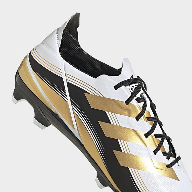 Front view of adidas Gamemode Firm Ground Soccer Cleats in Cloud White/Gold Metallic/Core Black Click to zoom