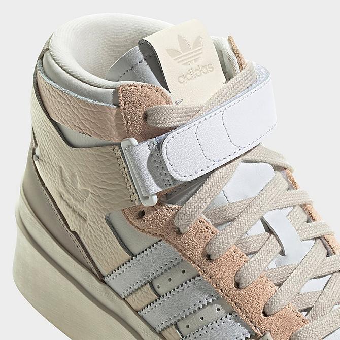 Front view of Women's adidas Originals Forum Bonega Mid Casual Shoes in Ecru Tint/White/Bliss Orange Click to zoom