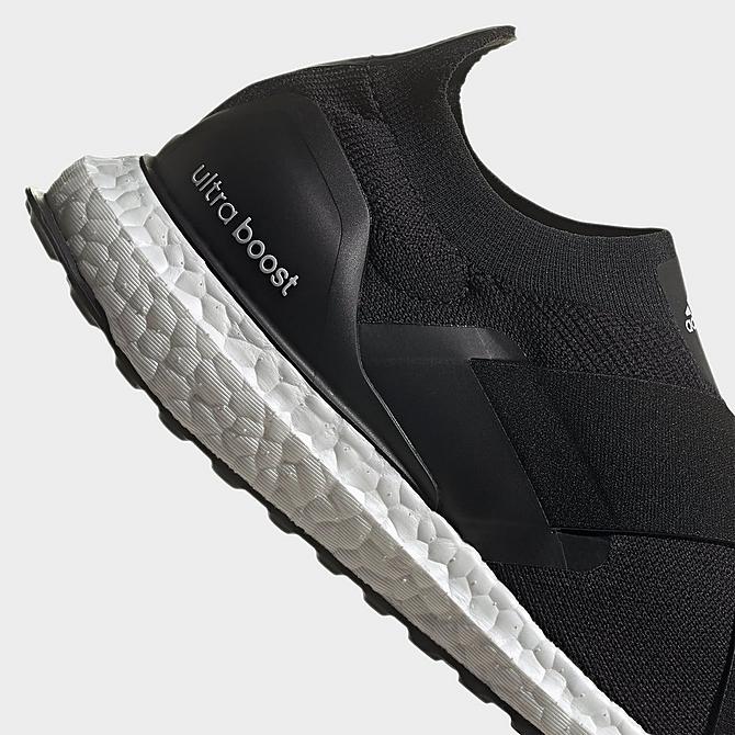 Left view of Women's adidas UltraBOOST DNA Slip-On Running Shoes in Black/Black/Acid Orange Click to zoom