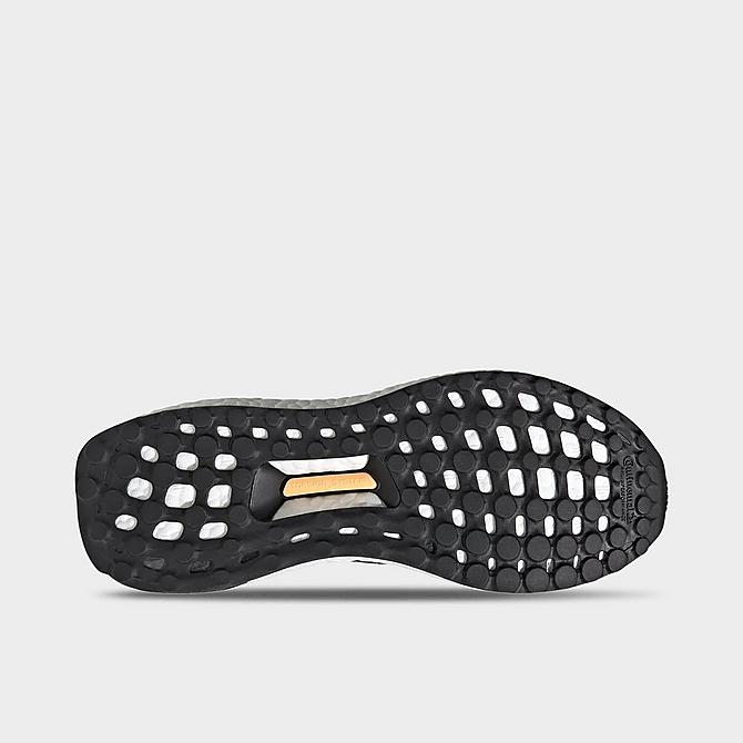 Bottom view of Women's adidas UltraBOOST DNA Slip-On Running Shoes in Black/Black/Acid Orange Click to zoom