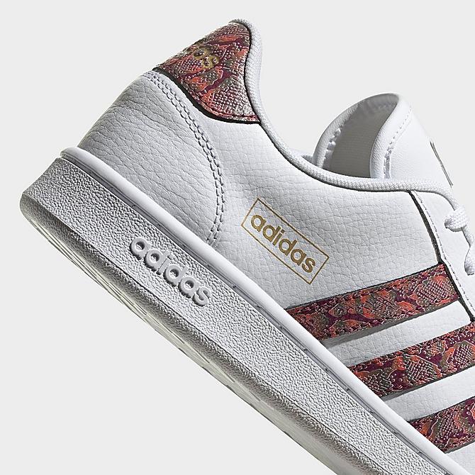 Left view of Women's adidas Grand Court SE Animal Casual Shoes in White/Victory Crimson/Screaming Orange Click to zoom