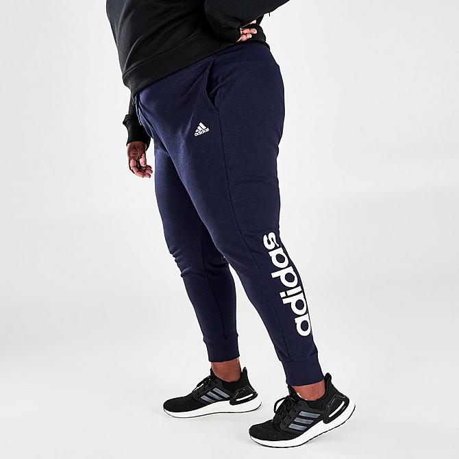 Front Three Quarter view of Women's adidas Essentials French Terry Logo Pants (Plus Size) in Legend Ink/White Click to zoom