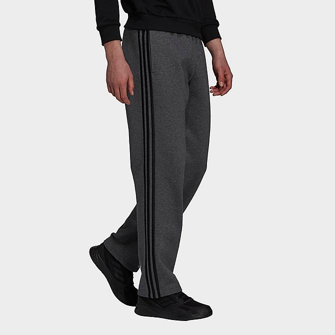 Front Three Quarter view of Men's adidas 3-Stripes Essentials Open Hem Fleece Pants in Dark Grey Heather/Black Click to zoom