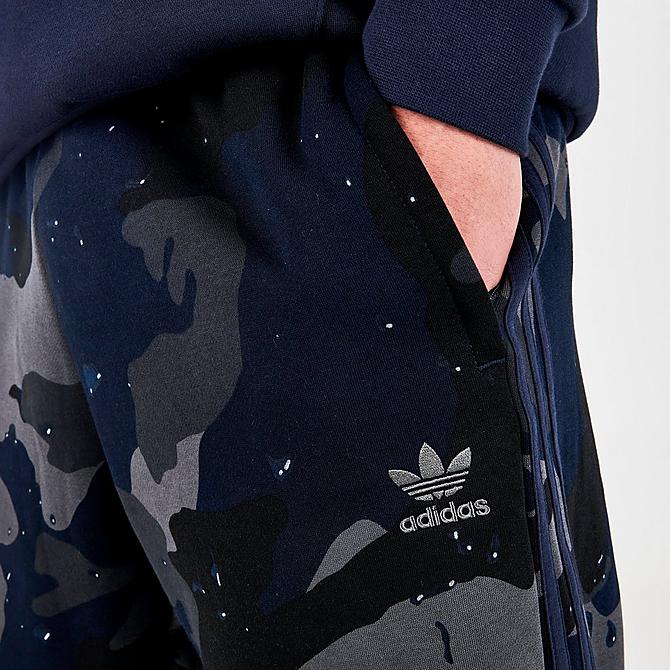 On Model 5 view of Men's adidas Originals 3-Stripes Camo Jogger Pants in Night Navy Click to zoom