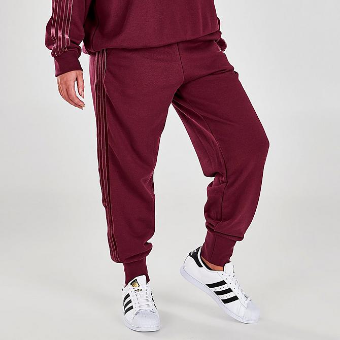 Back Left view of Women's adidas Originals Velvet Stripes with Trefoil Rivet Cuffed Pants in Victory Crimson Click to zoom