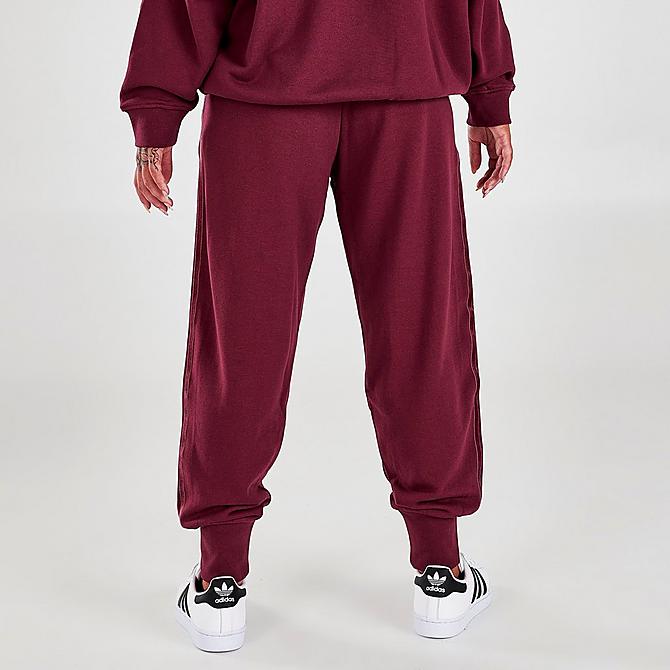 Back Right view of Women's adidas Originals Velvet Stripes with Trefoil Rivet Cuffed Pants in Victory Crimson Click to zoom