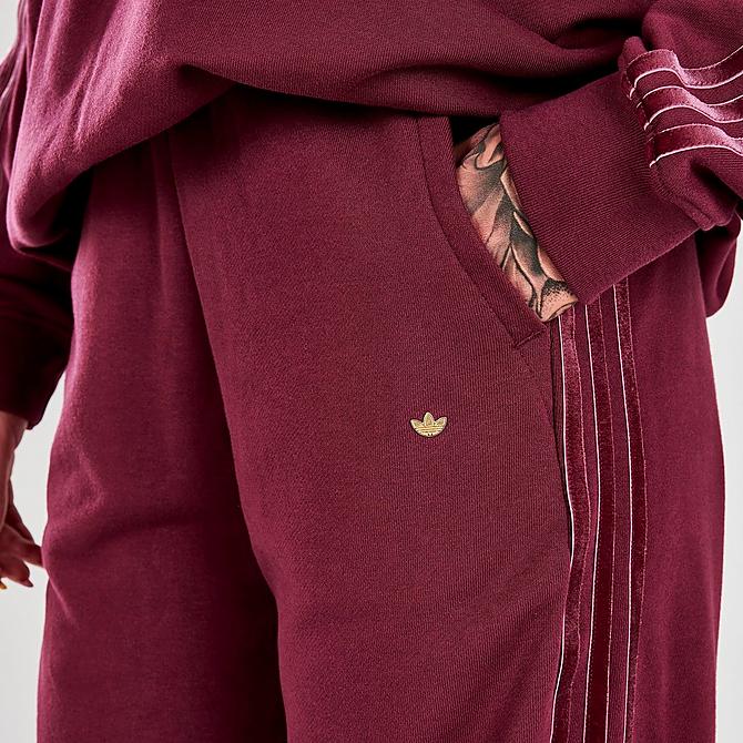 On Model 5 view of Women's adidas Originals Velvet Stripes with Trefoil Rivet Cuffed Pants in Victory Crimson Click to zoom