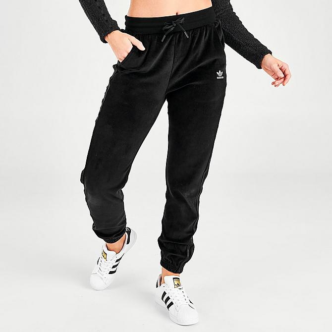 Front Three Quarter view of Women's adidas Originals Velour Slim Jogger Pants in Black Click to zoom