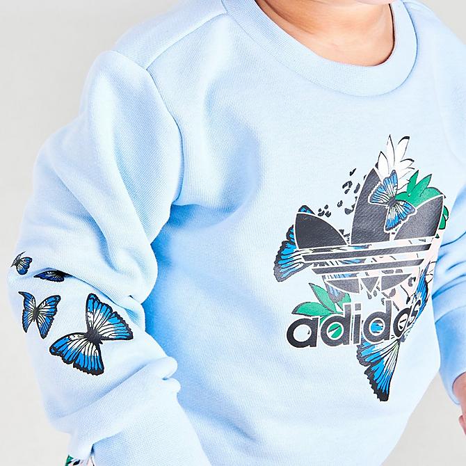 [angle] view of Girls' Infant and Toddler adidas Originals HER Studio London Floral Print Crewneck Sweatshirt and Leggings Set in Clear Sky Click to zoom