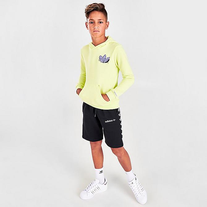 Front Three Quarter view of Kids' adidas Originals Funny Dino Graphic Hoodie in Pulse Yellow/Light Purple Click to zoom