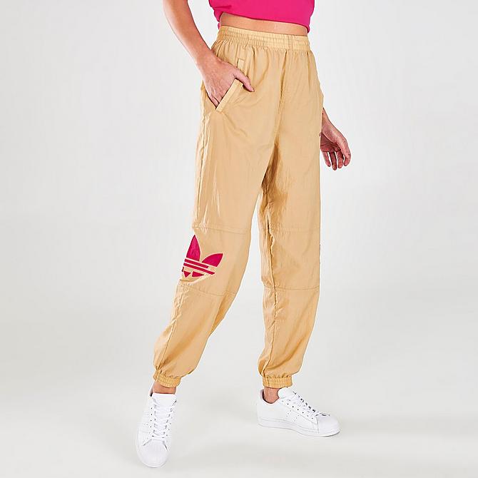 Back Left view of Women's adidas Originals Adicolor Shattered Trefoil Track Pants in Beige Tone/Pink Click to zoom