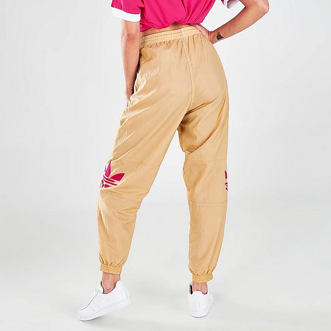 Back Right view of Women's adidas Originals Adicolor Shattered Trefoil Track Pants in Beige Tone/Pink Click to zoom