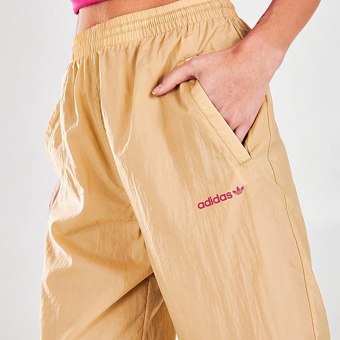 On Model 5 view of Women's adidas Originals Adicolor Shattered Trefoil Track Pants in Beige Tone/Pink Click to zoom