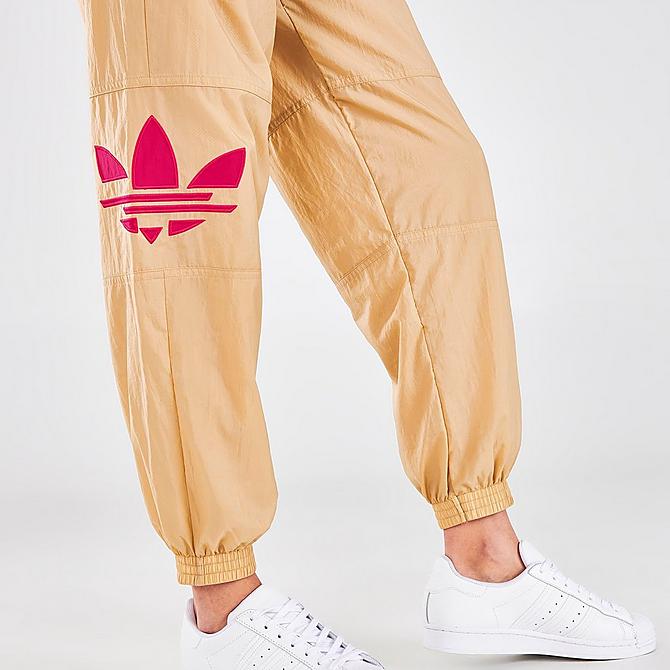 On Model 6 view of Women's adidas Originals Adicolor Shattered Trefoil Track Pants in Beige Tone/Pink Click to zoom