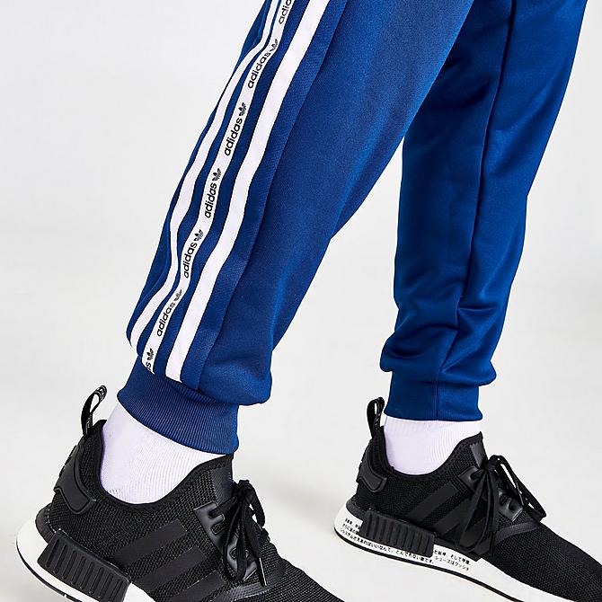 On Model 5 view of Boys' adidas Originals Tape Jogger Pants in Blue/White Click to zoom