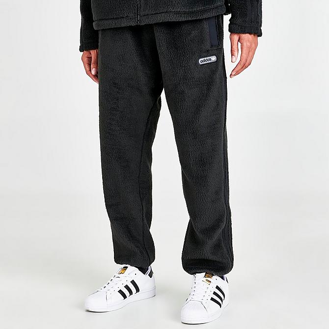 Front Three Quarter view of Men's adidas Originals Three Stripes Sherpa Jogger Pants in Black Click to zoom