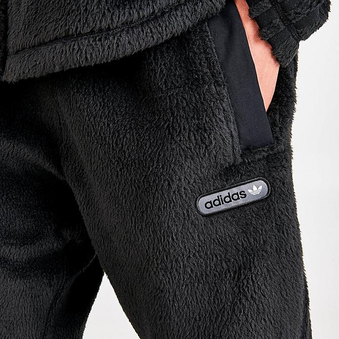 On Model 5 view of Men's adidas Originals Three Stripes Sherpa Jogger Pants in Black Click to zoom